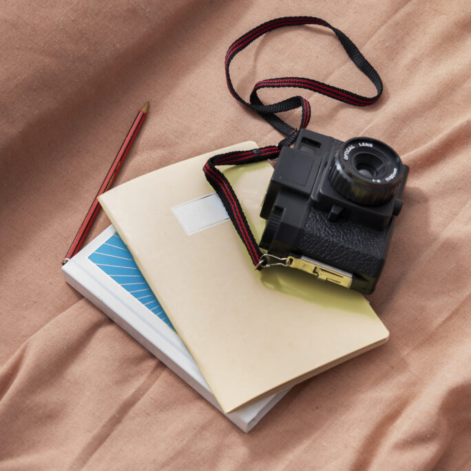 high-angle-photo-camera-notebook